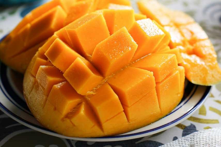 A closeup of diced mango, a key ingredient of The Tropical Sunrise Antioxidant Smoothie.